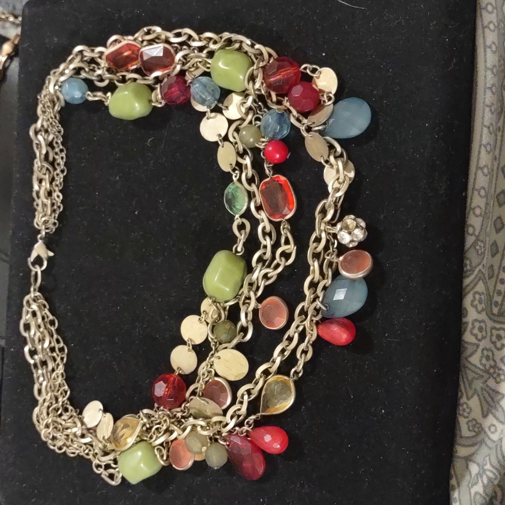 LOTS OF CHARMS ATTACHED TOGETHER WITH LOTS OF BEADS AND SHAPES